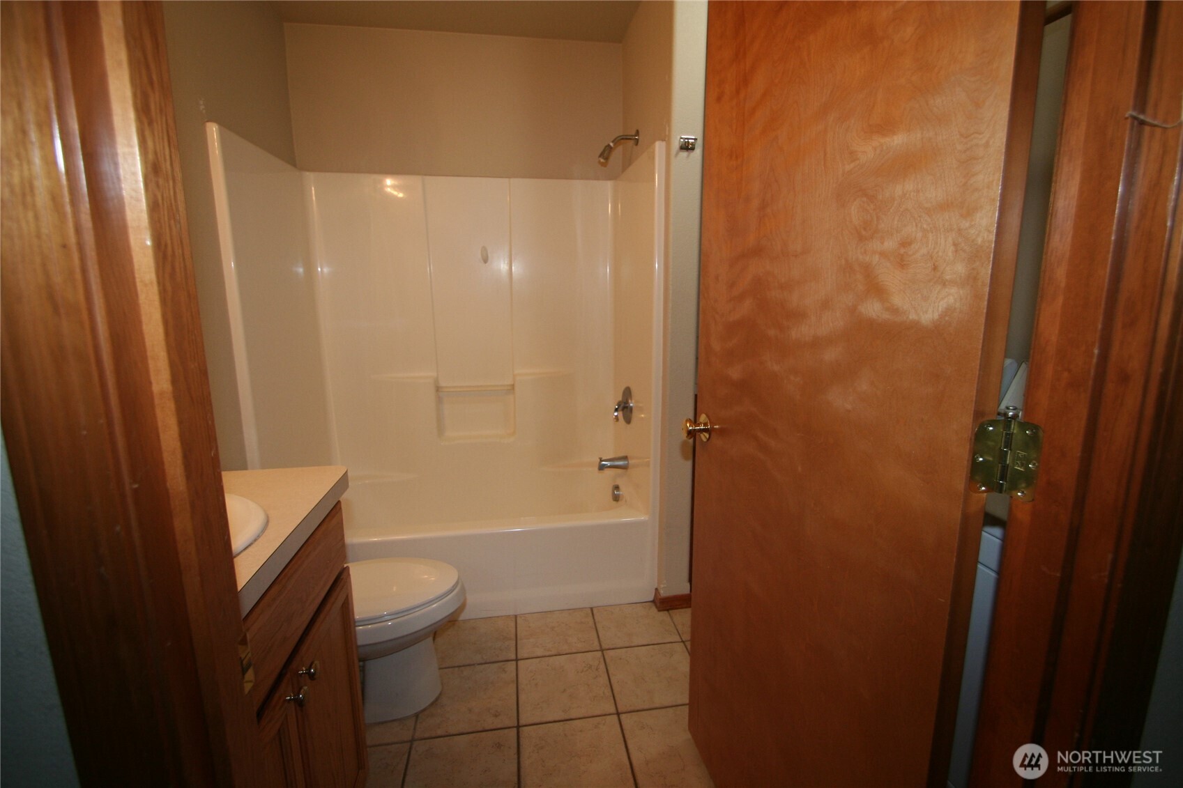 673 Southwest 20th Street Chehalis, WA 98532 - Photo 11 of 17 a bathroom with a granite countertop sink a toilet and shower