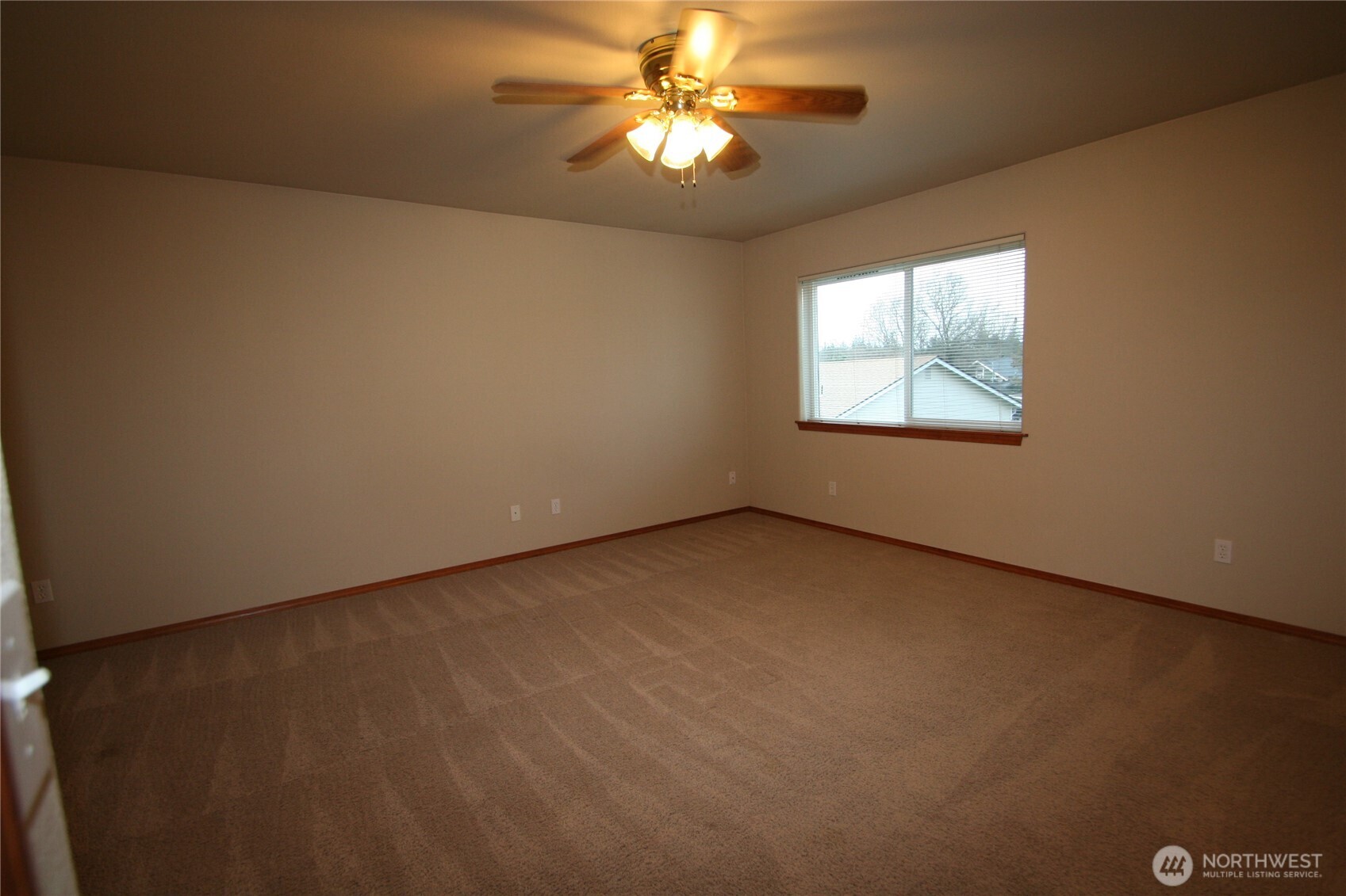 673 Southwest 20th Street Chehalis, WA 98532 - Photo 16 of 17 a view of an empty room with window chandelier fan