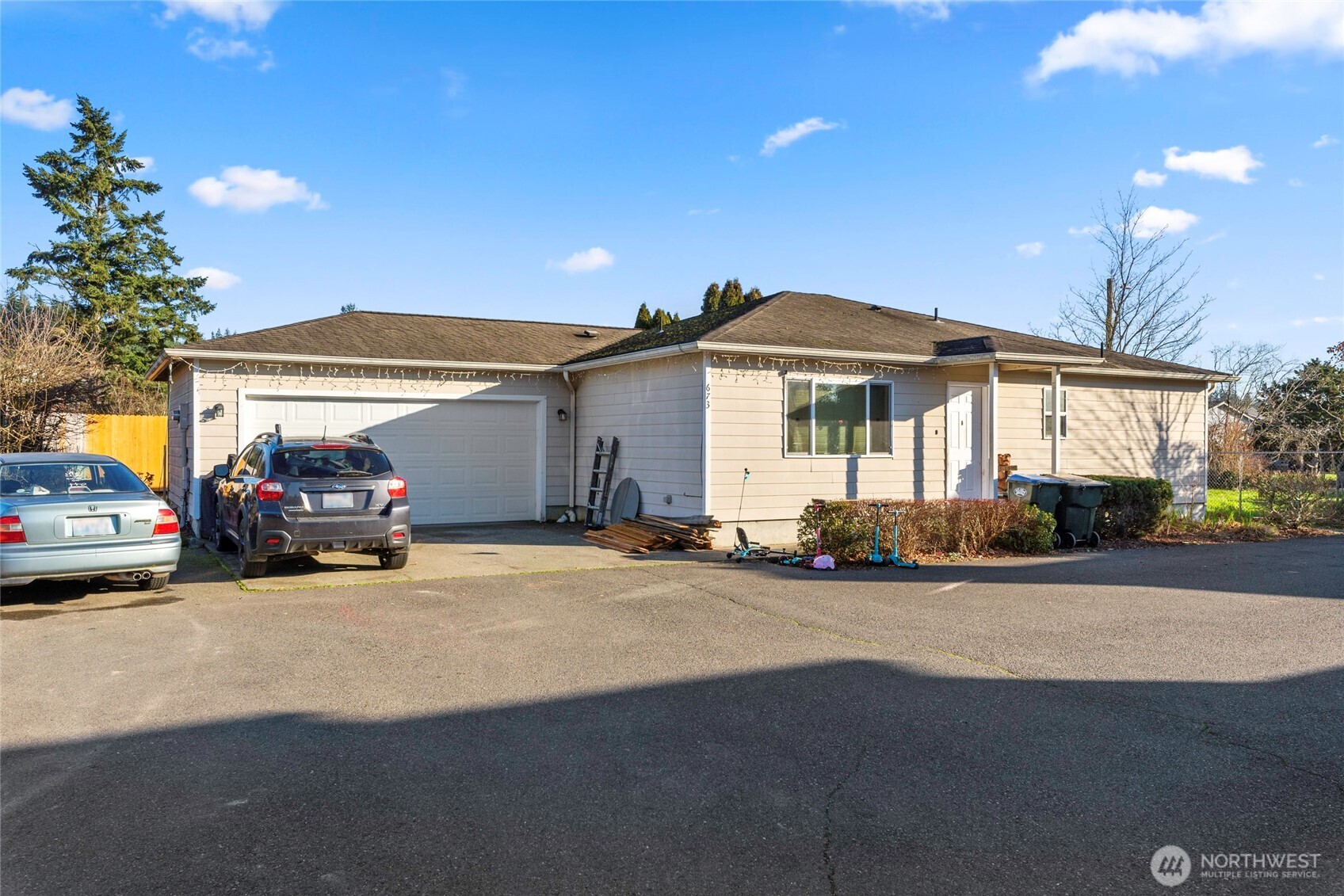 673 Southwest 20th Street Chehalis, WA 98532 - Photo 6 of 17 a view of a car is parked in front of a house