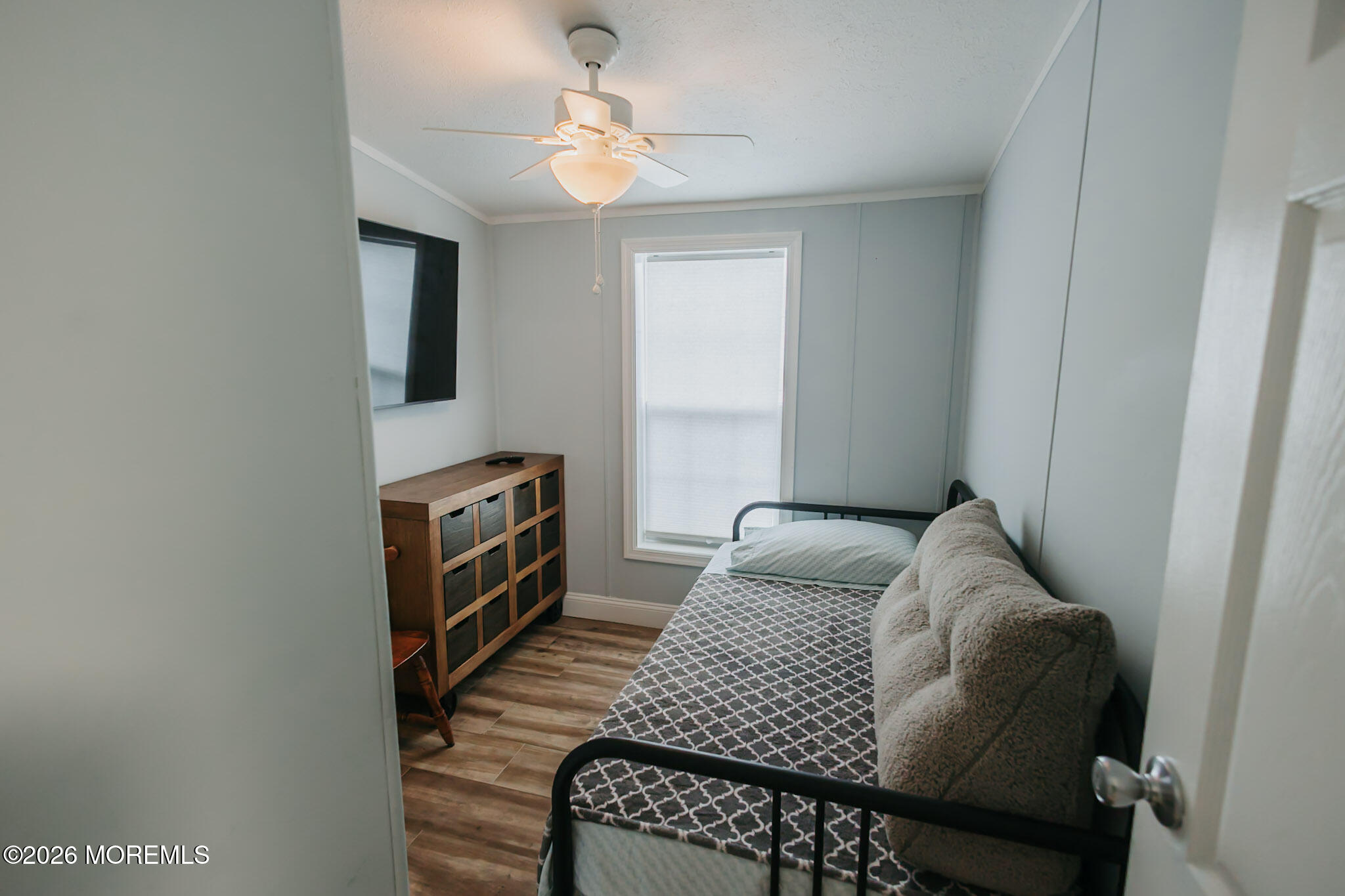 14 Locust Grove Hazlet, NJ 07730 - Photo 11 of 25 a bedroom with a bed and a chandelier