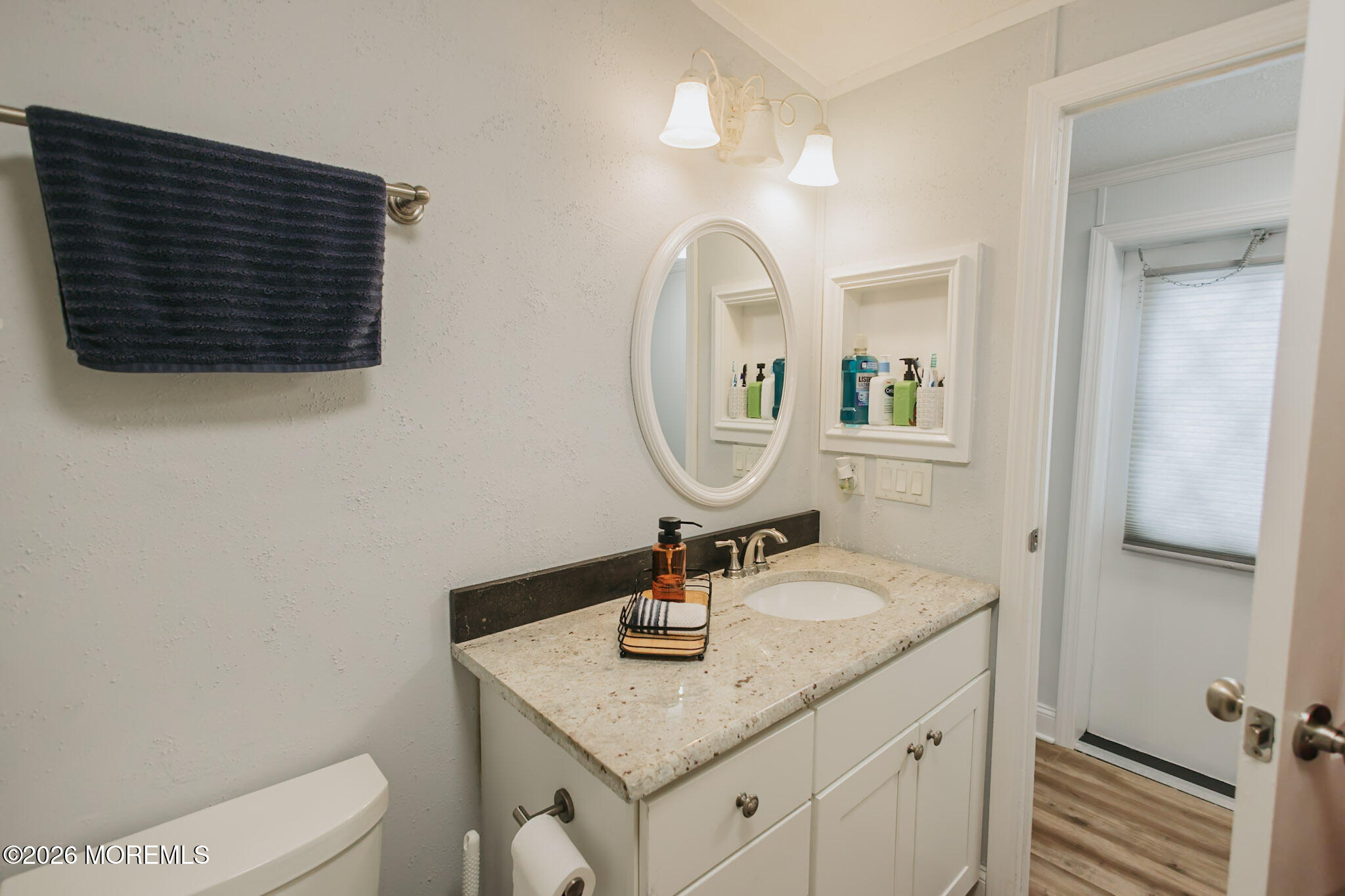 14 Locust Grove Hazlet, NJ 07730 - Photo 14 of 25 a bathroom with a sink a toilet and a mirror
