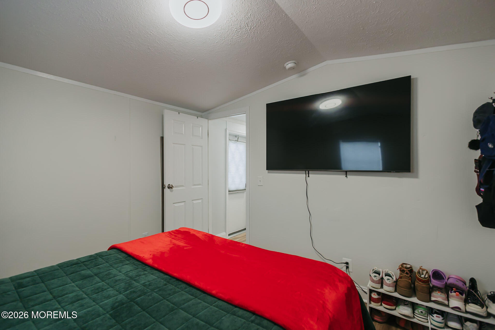 14 Locust Grove Hazlet, NJ 07730 - Photo 17 of 25 a living room with a flat screen tv