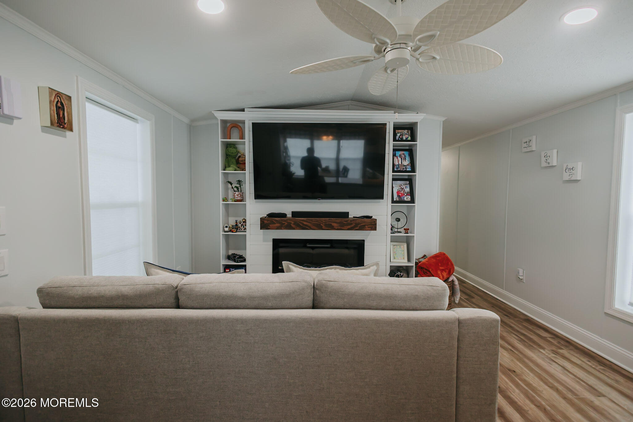 14 Locust Grove Hazlet, NJ 07730 - Photo 4 of 25 a living room with furniture a fireplace and a flat screen tv