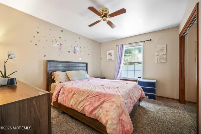 a bedroom with a bed and a table