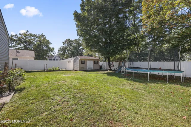 a view of a backyard with a small cabin