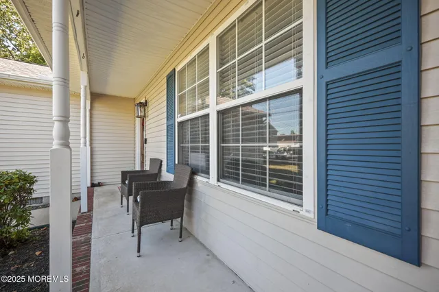 a view of a chair and table in the balcony