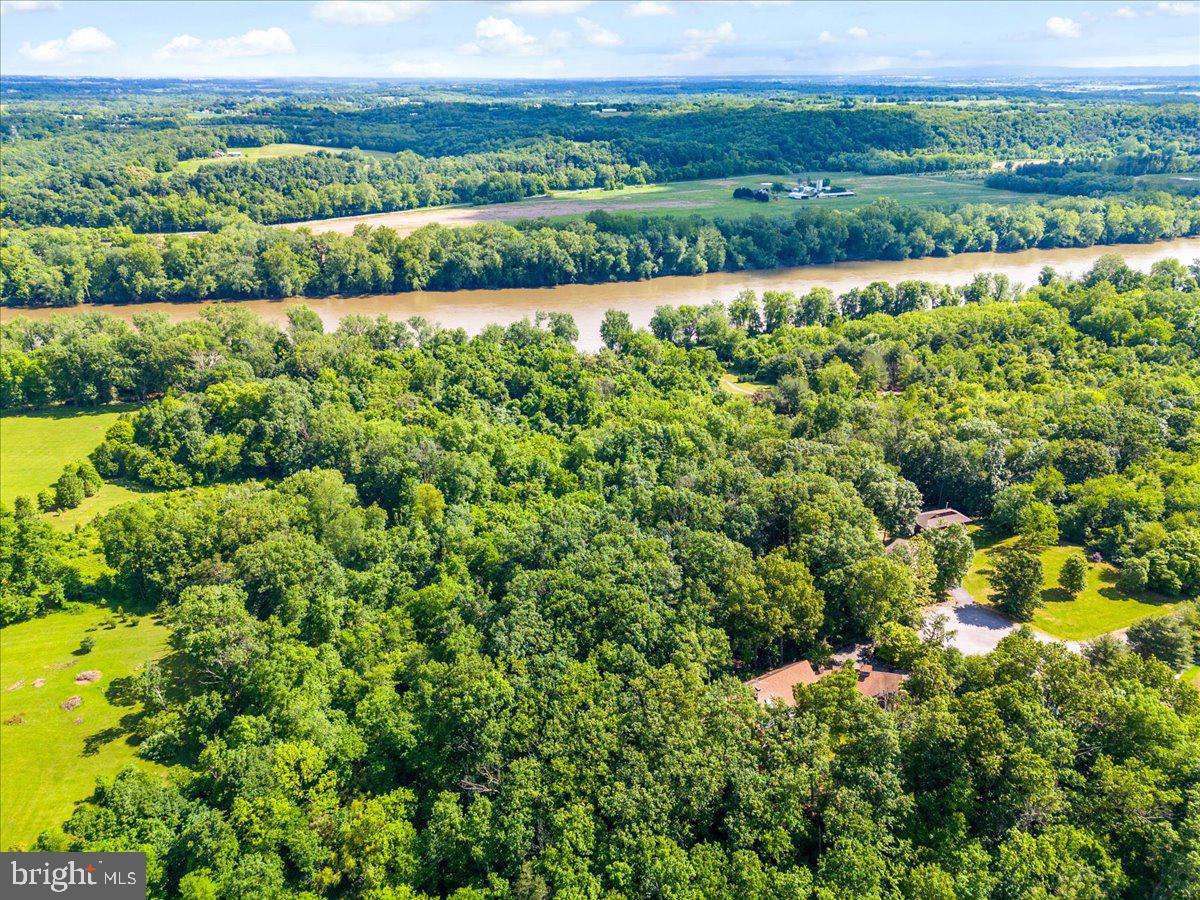 Gideon Lane Falling Waters, WV 25419 - Photo 2 of 23 a view of a green field with an ocean view