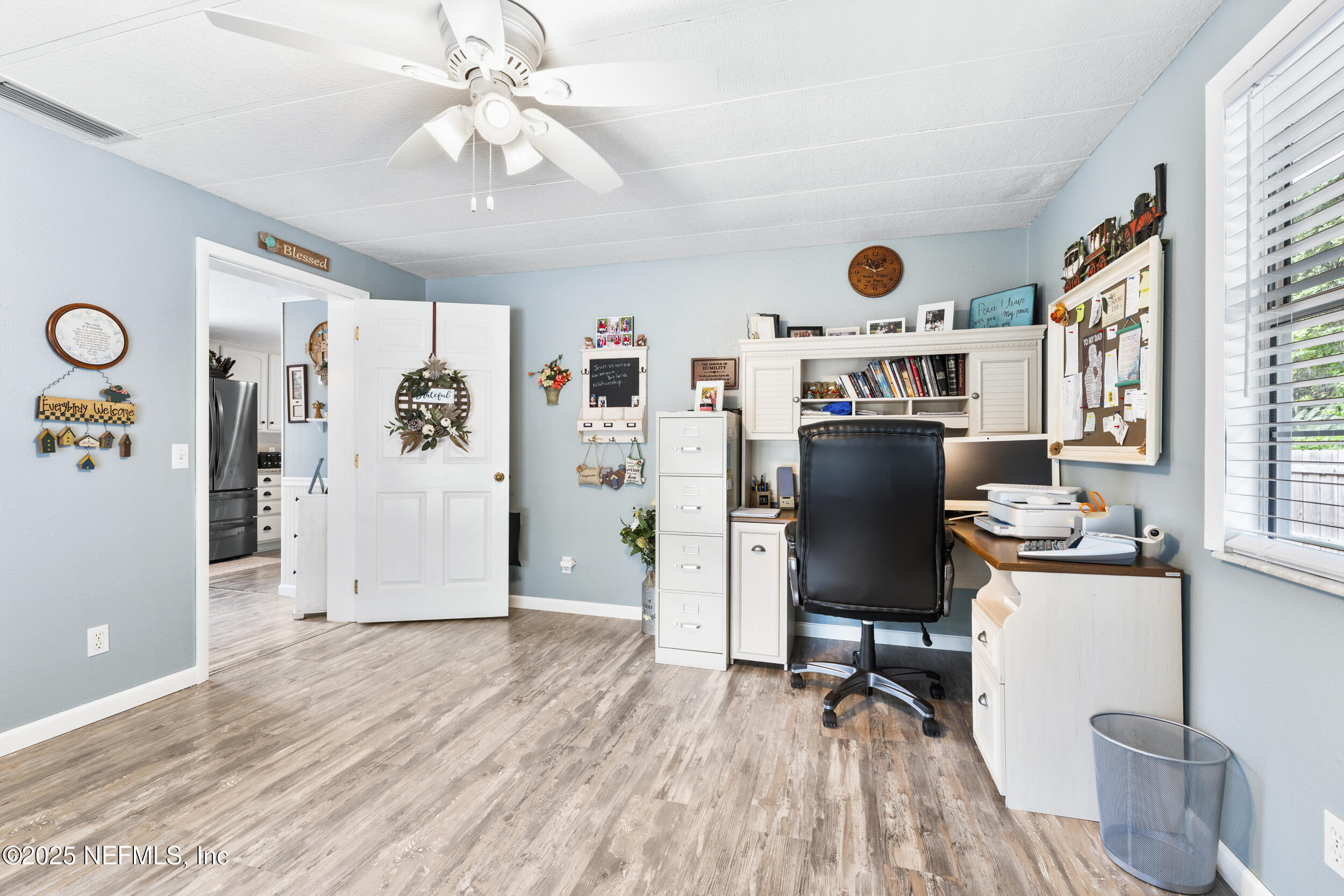 155 Tompkins Road Pomona Park, FL 32181 - Photo 11 of 38 a view of a workspace with furniture and a window