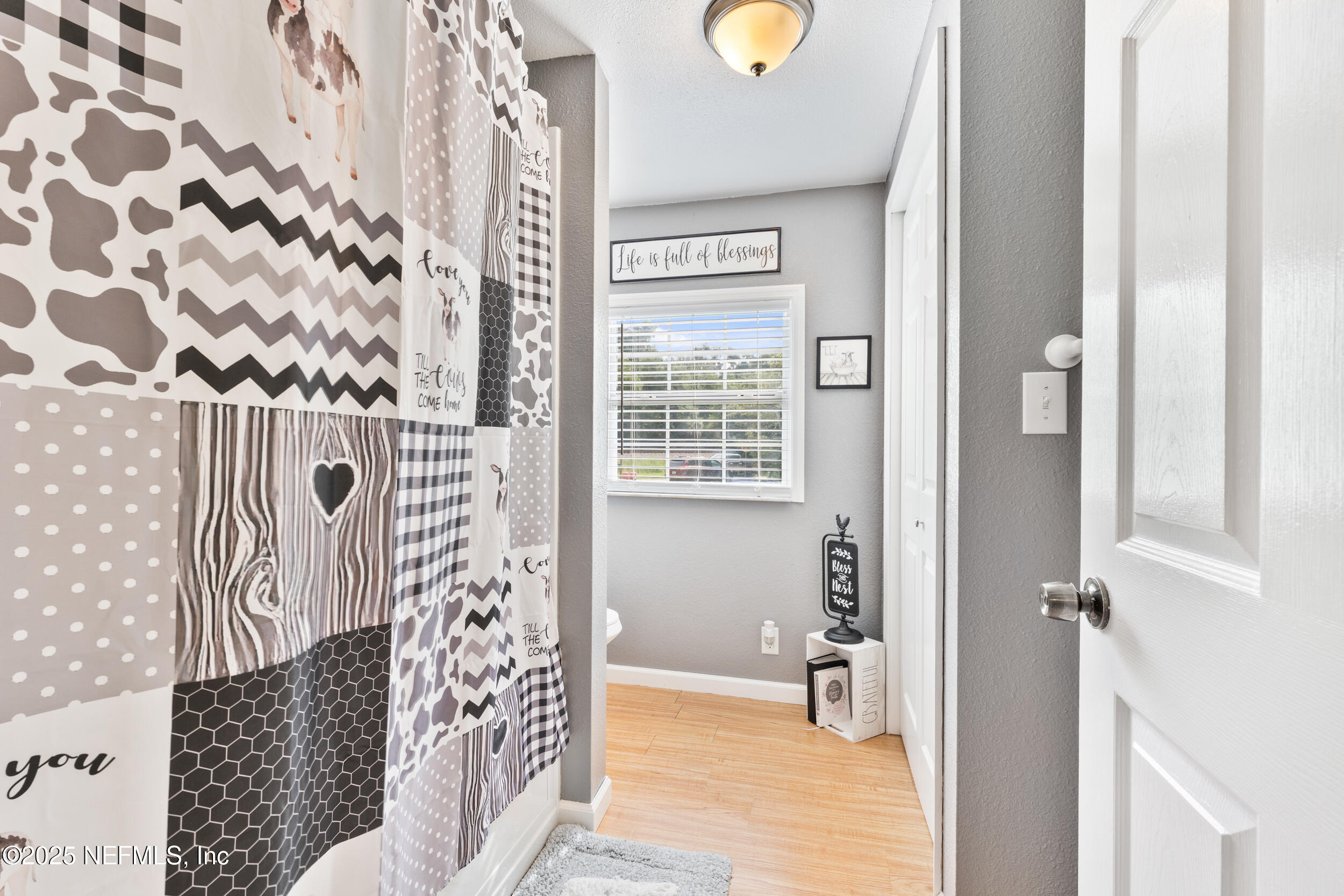 155 Tompkins Road Pomona Park, FL 32181 - Photo 17 of 38 a view of a wooden floor with windows