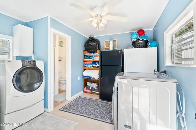 a view of a chairs and tables on the roof deck