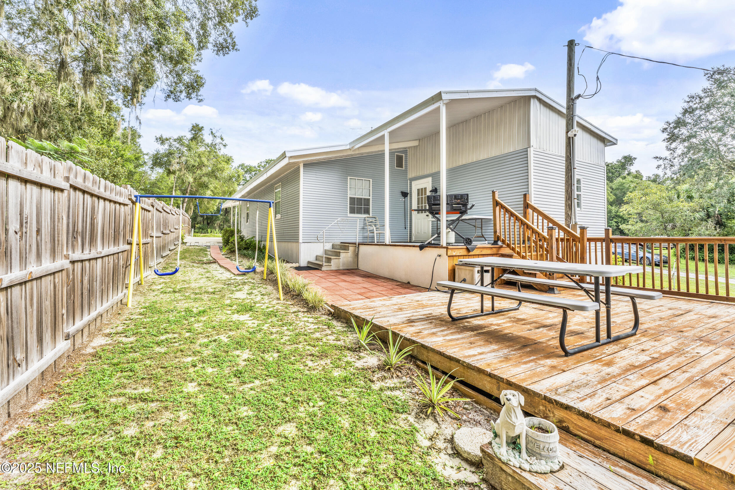 155 Tompkins Road Pomona Park, FL 32181 - Photo 22 of 38 a view of a house with backyard and sitting area