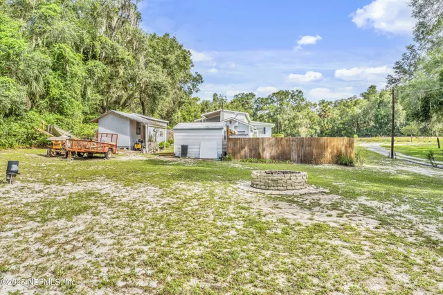 a view of a yard with an outdoor space