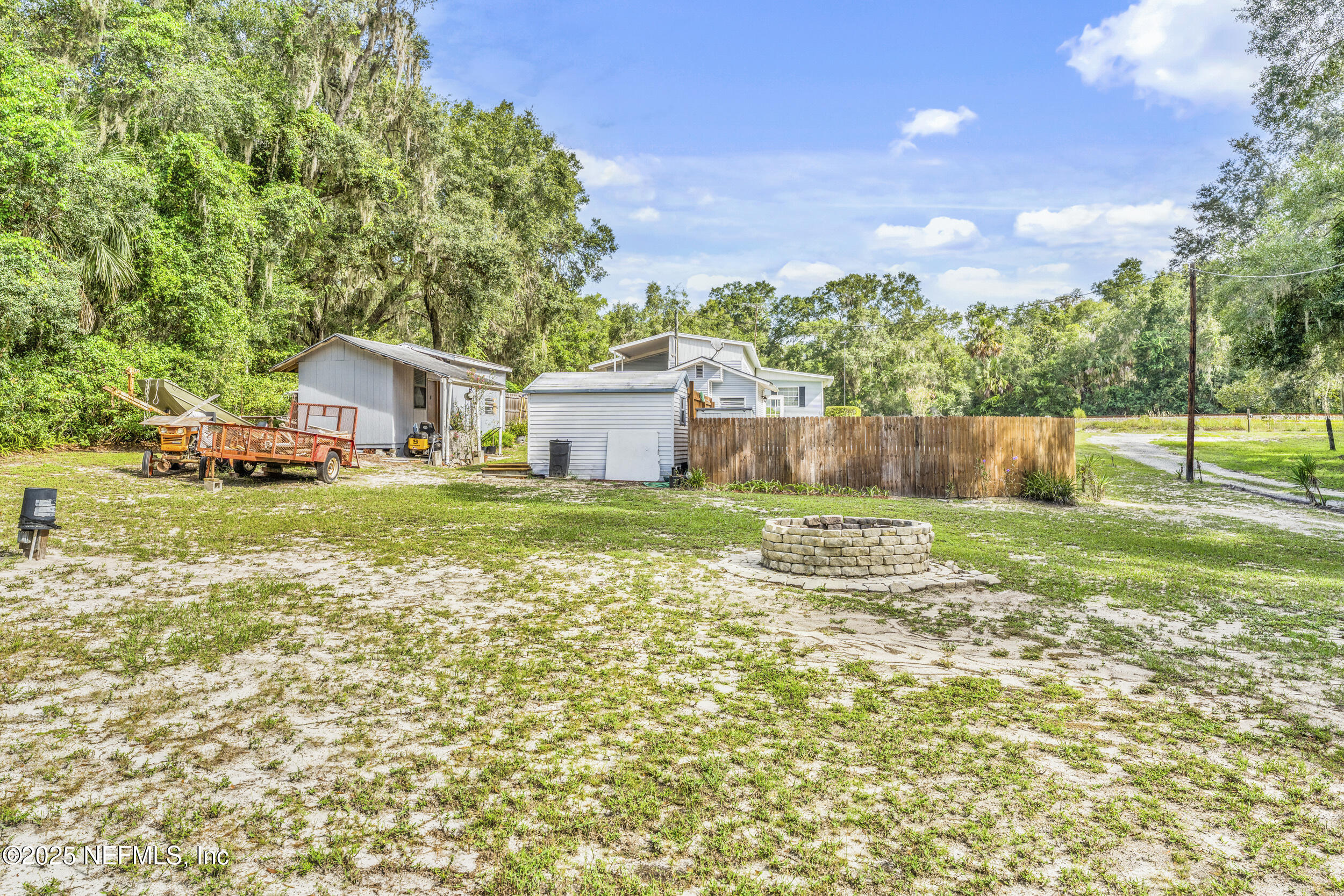 155 Tompkins Road Pomona Park, FL 32181 - Photo 28 of 38 a view of a house with a yard