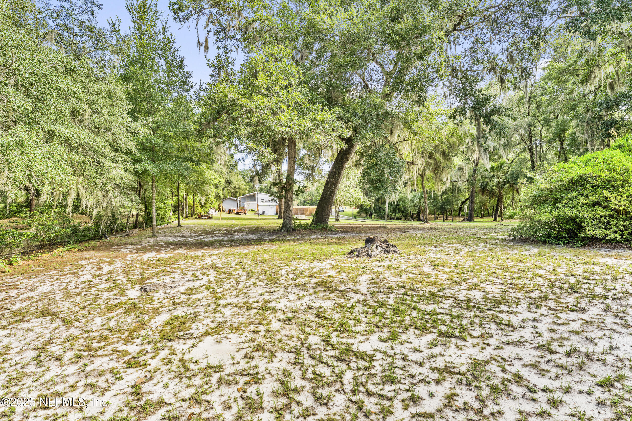 155 Tompkins Road Pomona Park, FL 32181 - Photo 31 of 38 a view of outdoor space with deck and trees