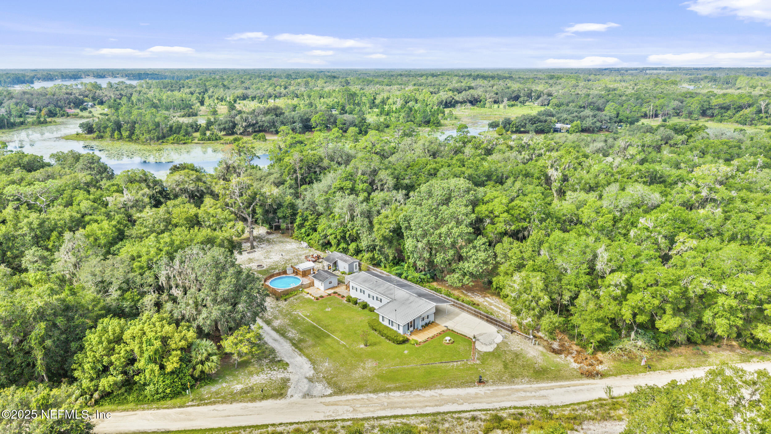 155 Tompkins Road Pomona Park, FL 32181 - Photo 34 of 38 a view of a yard with an outdoor space