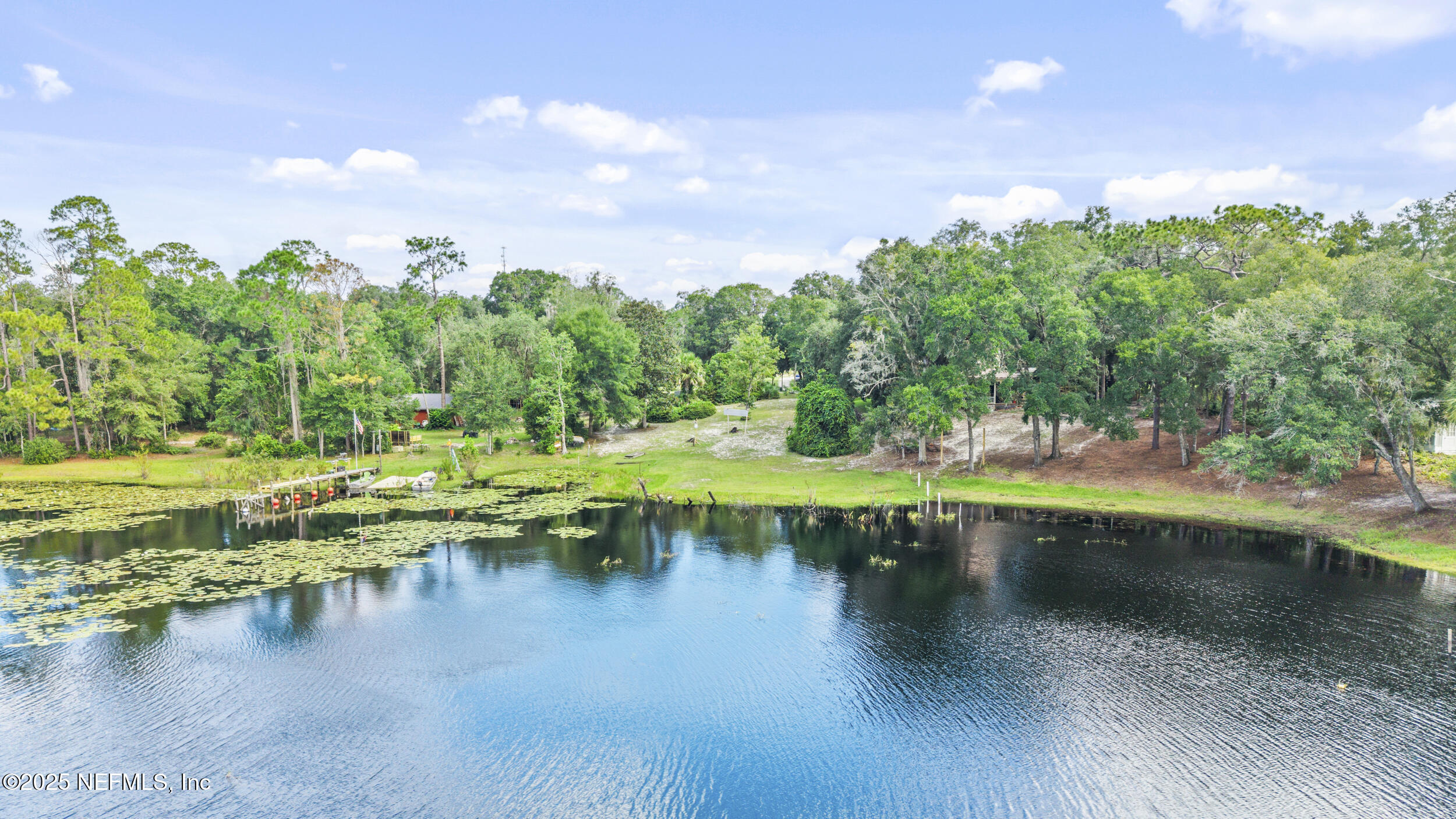 155 Tompkins Road Pomona Park, FL 32181 - Photo 38 of 38 a view of a lake with houses