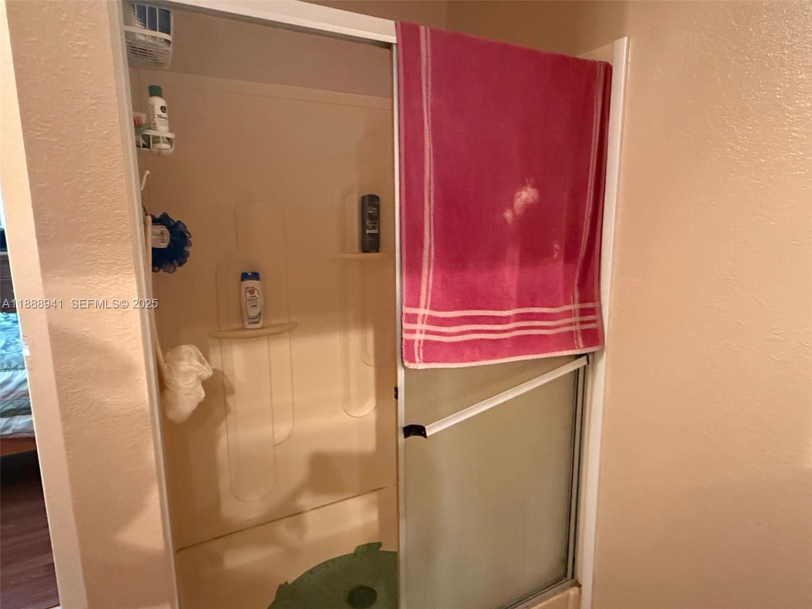 120 South Nogal Street Clewiston, FL 33440 - Photo 11 of 41 a bathroom with a shower and a sink