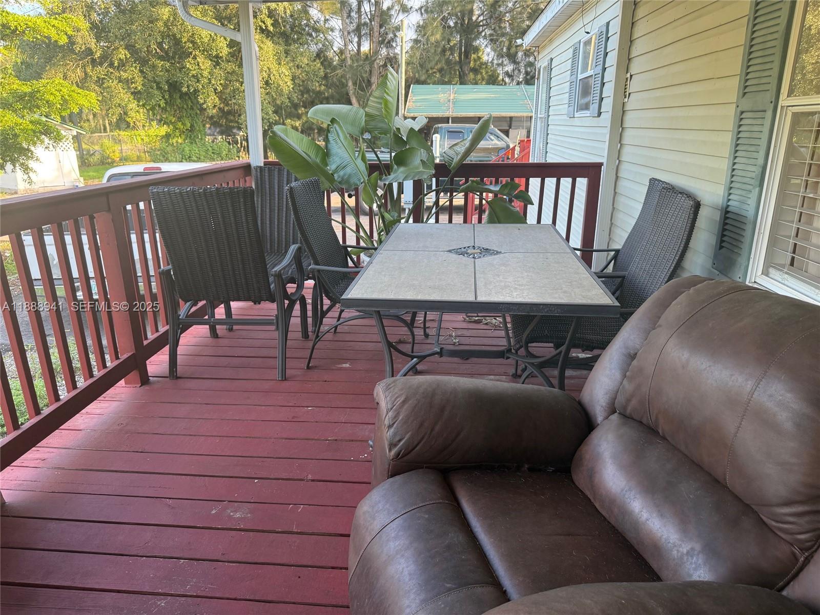 120 South Nogal Street Clewiston, FL 33440 - Photo 18 of 41 a balcony view with a seating space