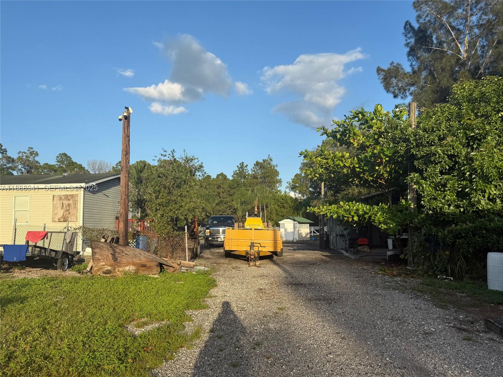 120 South Nogal Street Clewiston, FL 33440 - Photo 31 of 41 a green field with lots of trees in the background