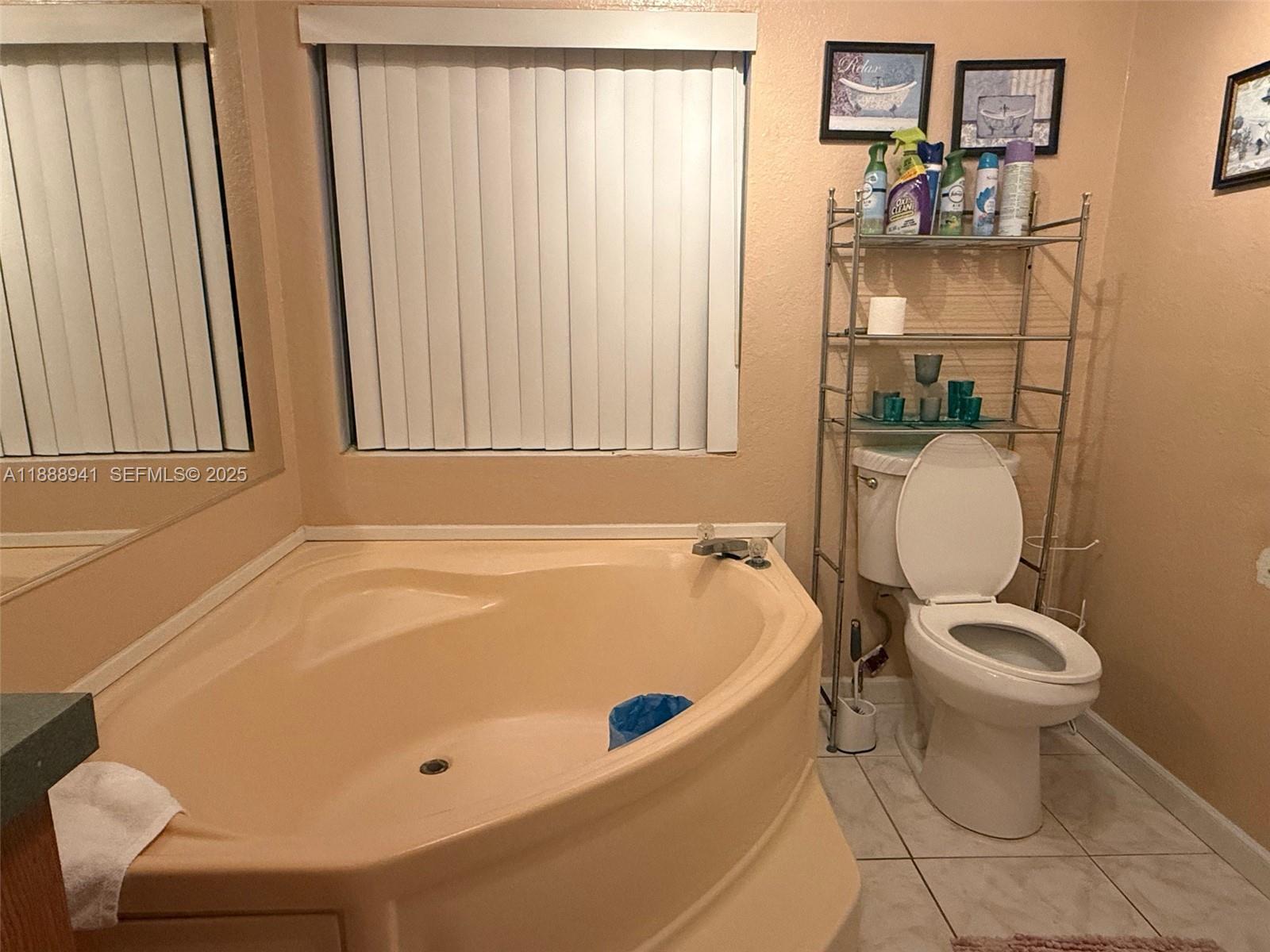 120 South Nogal Street Clewiston, FL 33440 - Photo 9 of 41 a bathroom with a sink and toilet