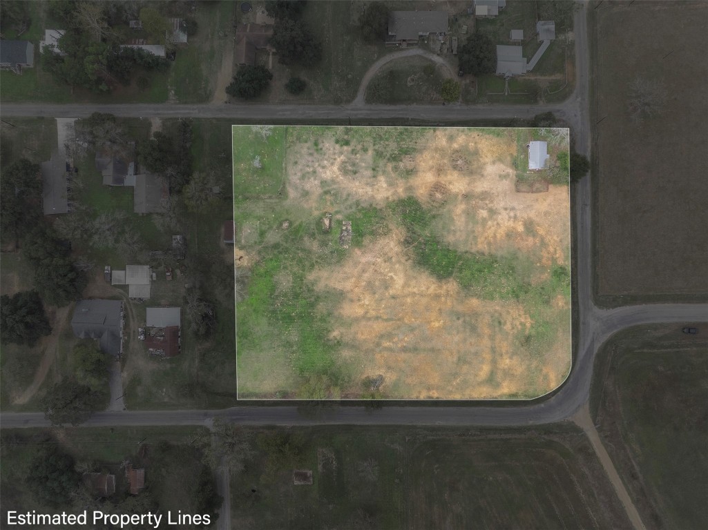 621 Tenth Street Lexington, TX 78947 - Photo 12 of 25 Aerial view of property and surrounding area featuring property parcel outlined