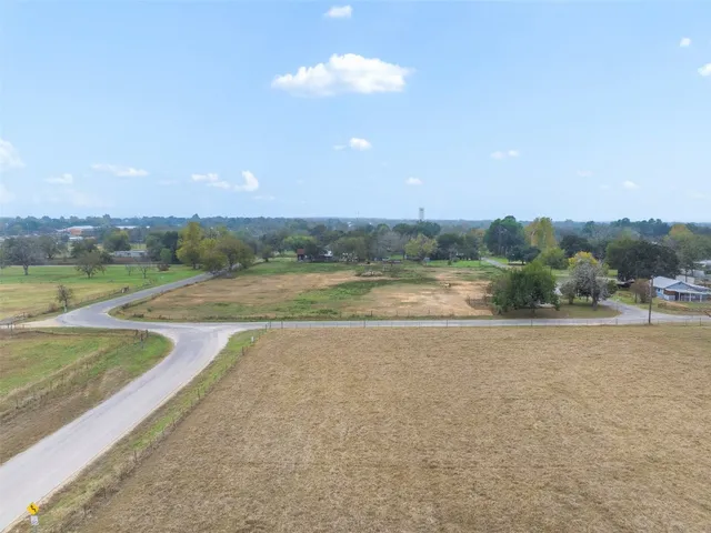 a view of a swimming pool and an outdoor seating