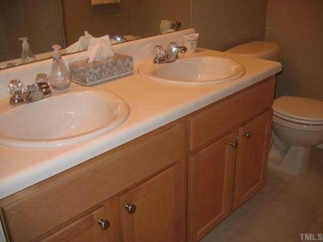 1626 Brook Fern Way Raleigh, NC 27609 - Photo 6 of 8 Master Bathroom Offers Dual Vanity and Oversized Garden Tub.