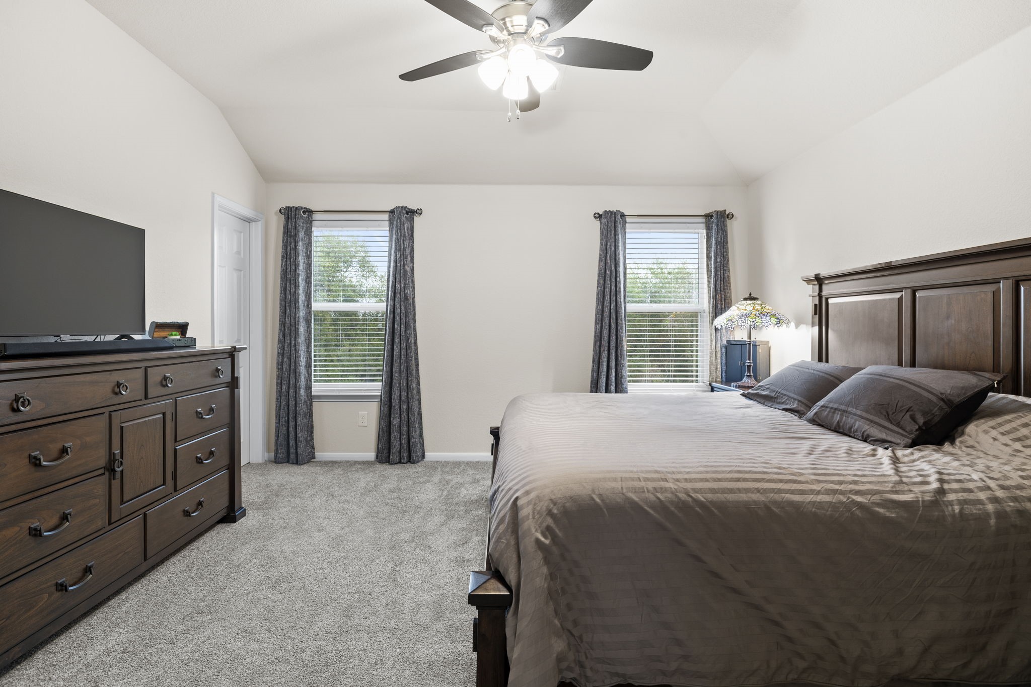 10710 Chestnut Path Way Tomball, TX 77375 - Photo 15 of 26 a bedroom with a bed and a flat screen tv