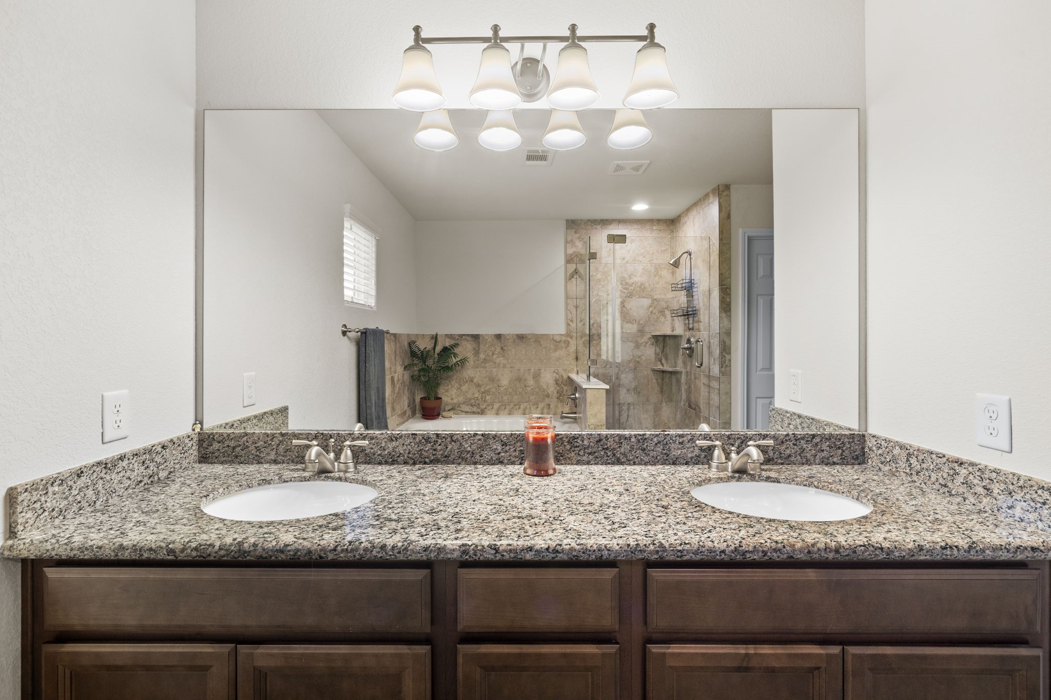 10710 Chestnut Path Way Tomball, TX 77375 - Photo 18 of 26 a bathroom with a granite countertop double vanity sinks and a mirror