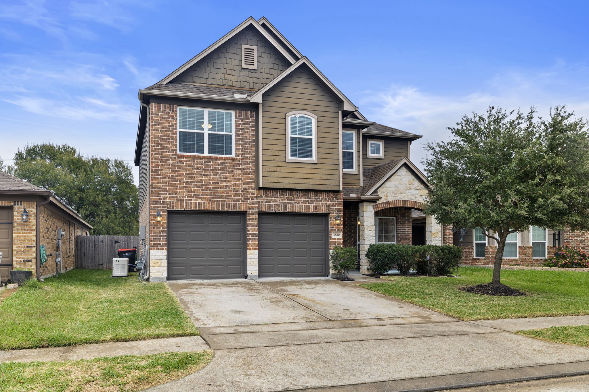 10710 Chestnut Path Way Tomball, TX 77375 - Photo 2 of 26 a front view of a house with a yard