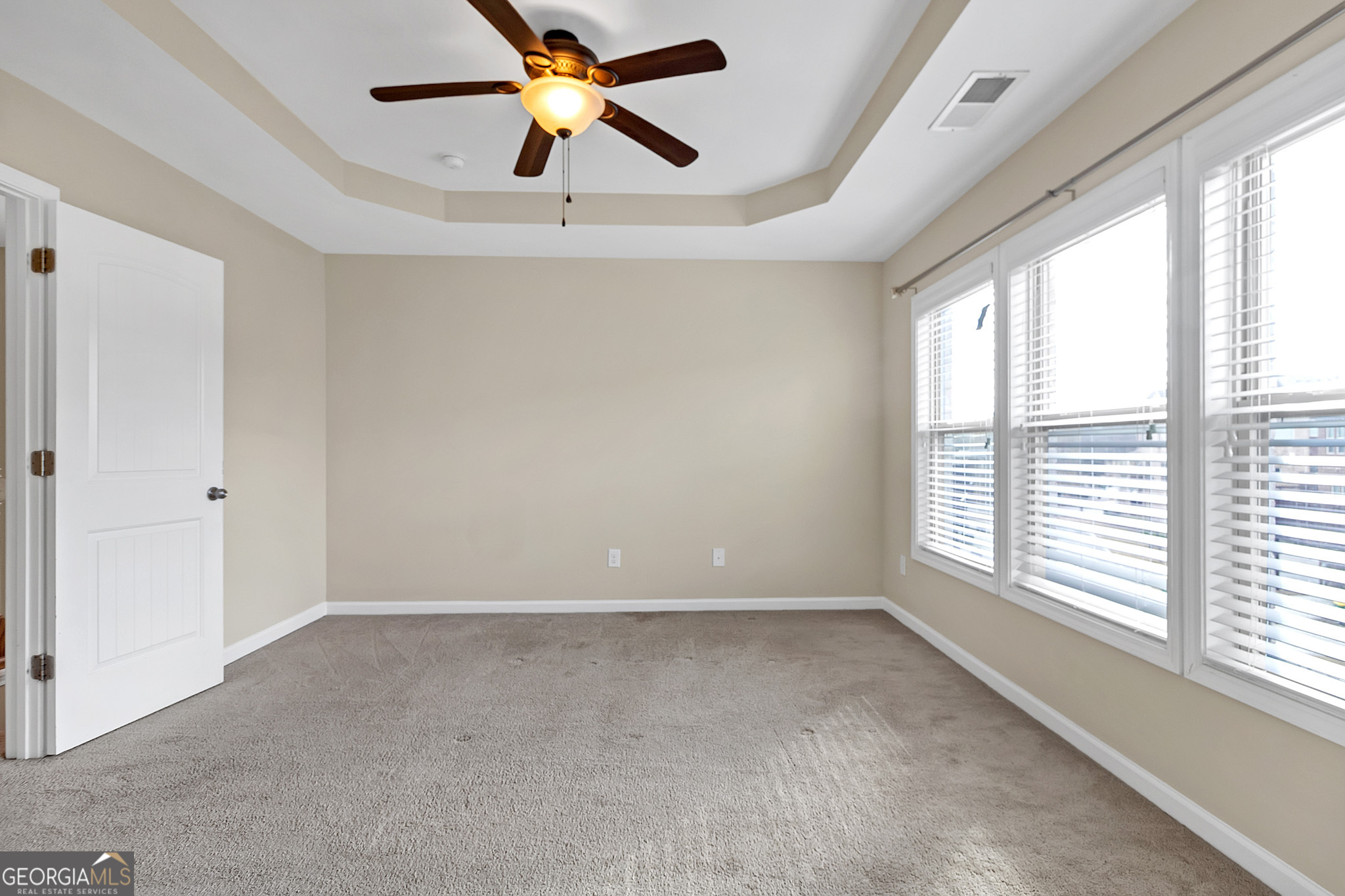 836 Ivy Vine Way Milton, GA 30004 - Photo 11 of 16 a view of room with a ceiling fan and window