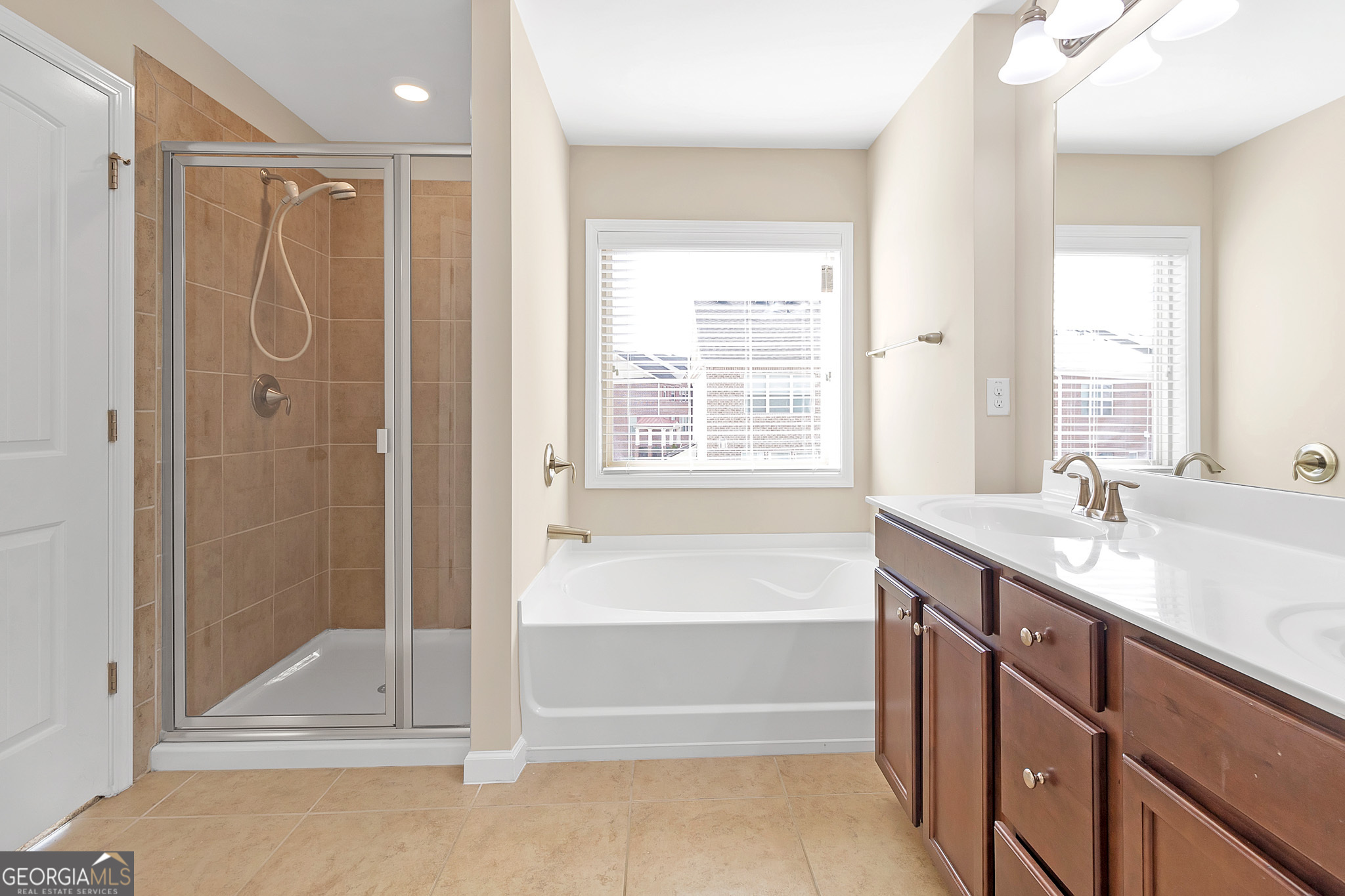 836 Ivy Vine Way Milton, GA 30004 - Photo 12 of 16 a bathroom with a tub sink shower and mirror