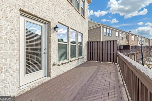 a view of a balcony with wooden floor