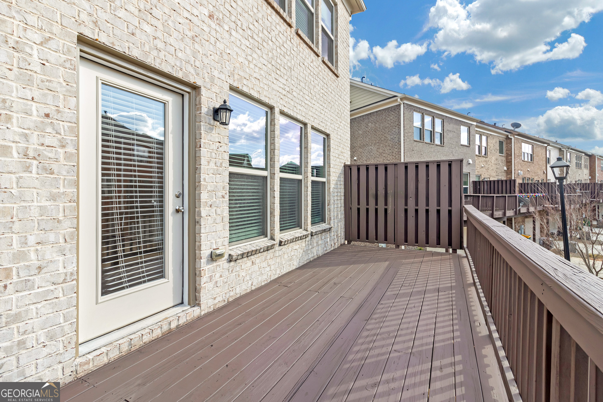 836 Ivy Vine Way Milton, GA 30004 - Photo 15 of 16 a view of a balcony with wooden floor
