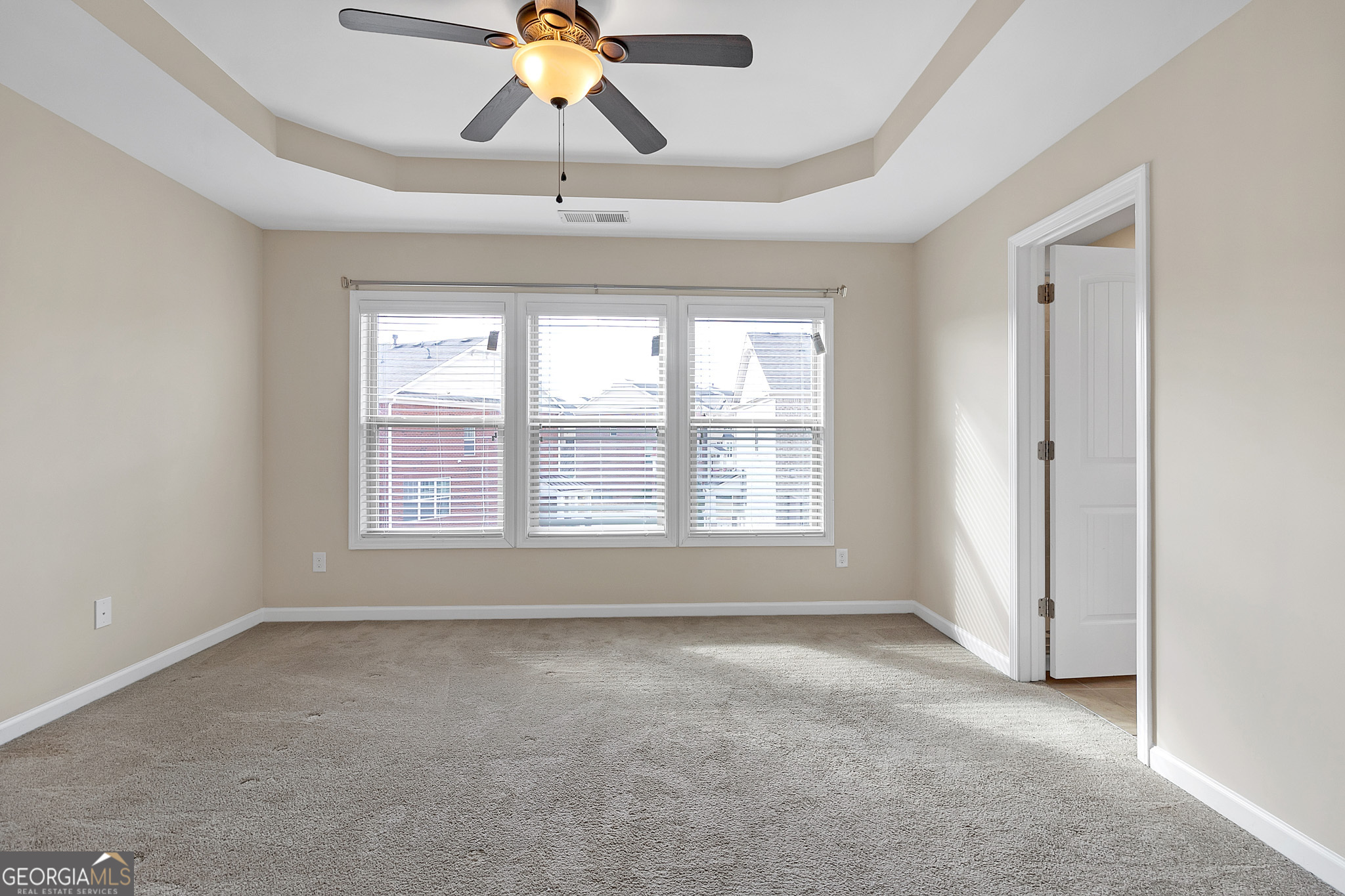 836 Ivy Vine Way Milton, GA 30004 - Photo 10 of 16 a view of an empty room with a window
