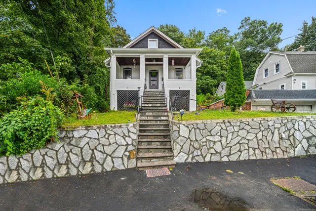 a front view of a house with a garage