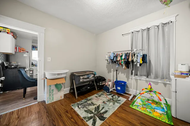 a children room with furniture and toys