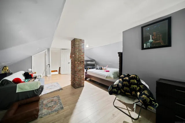 a bedroom with furniture and a couch