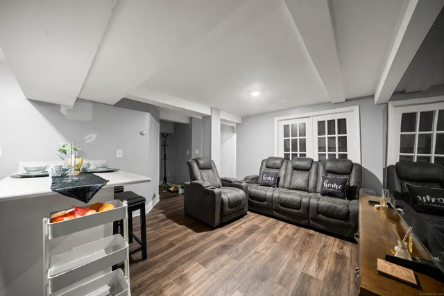 a living room with furniture window and wooden floor