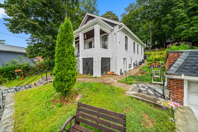 a front view of a house with garden