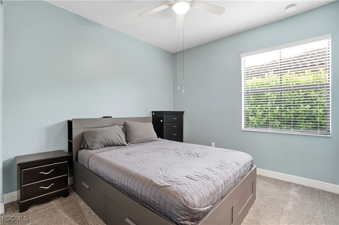 5355 Ferrari Avenue Ave Maria, FL 34142 - Photo 16 of 28 a bedroom with a bed and a window