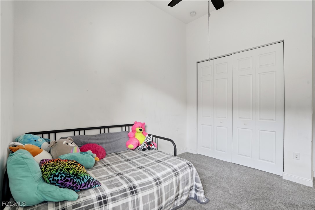 5355 Ferrari Avenue Ave Maria, FL 34142 - Photo 19 of 28 a bedroom with a bed and a painting on the wall