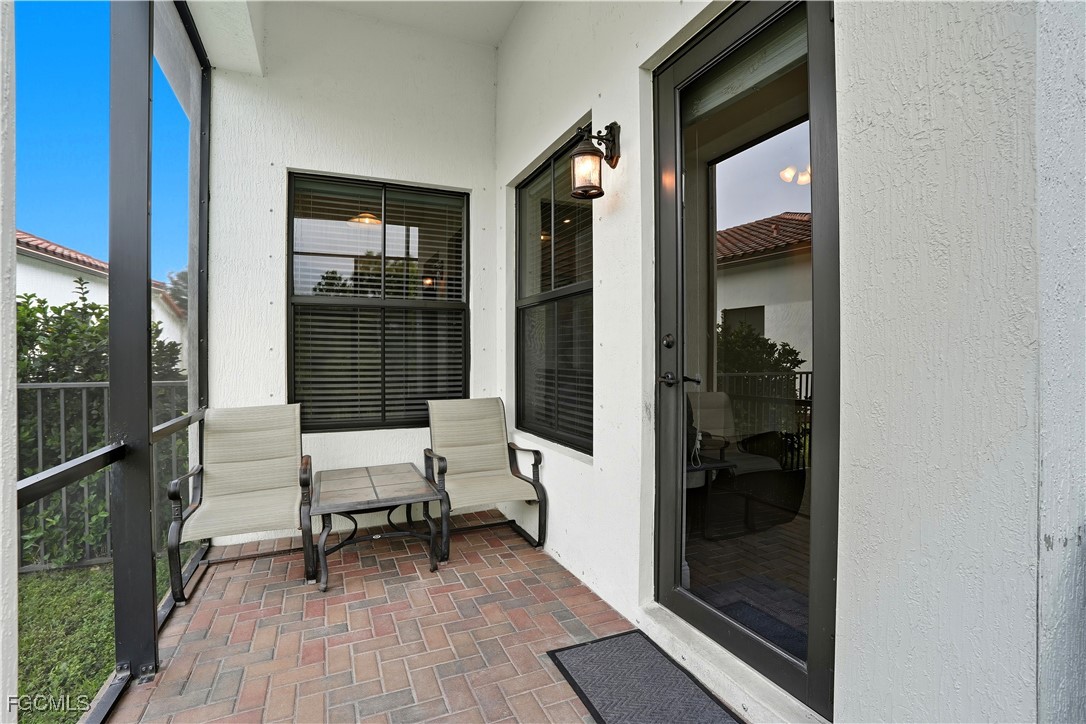 5355 Ferrari Avenue Ave Maria, FL 34142 - Photo 24 of 28 a balcony with chairs and outdoor view