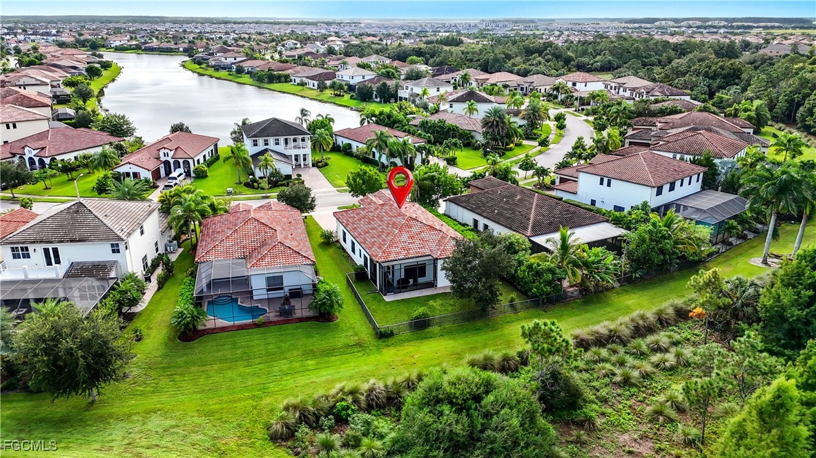5355 Ferrari Avenue Ave Maria, FL 34142 - Photo 28 of 28 an aerial view of a house with a garden and lake view