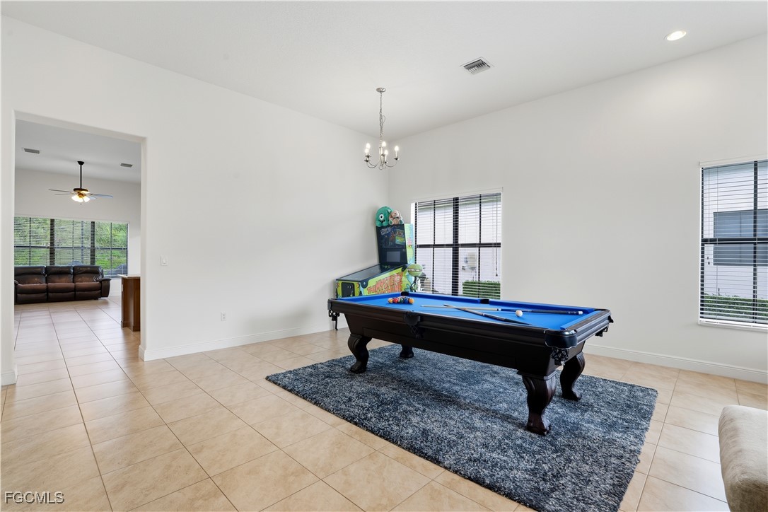 5355 Ferrari Avenue Ave Maria, FL 34142 - Photo 4 of 28 a living room with furniture and a rug
