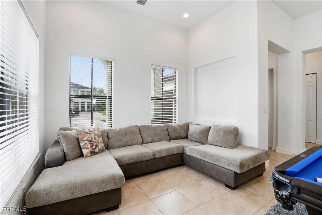 5355 Ferrari Avenue Ave Maria, FL 34142 - Photo 5 of 28 a living room with furniture and a couch