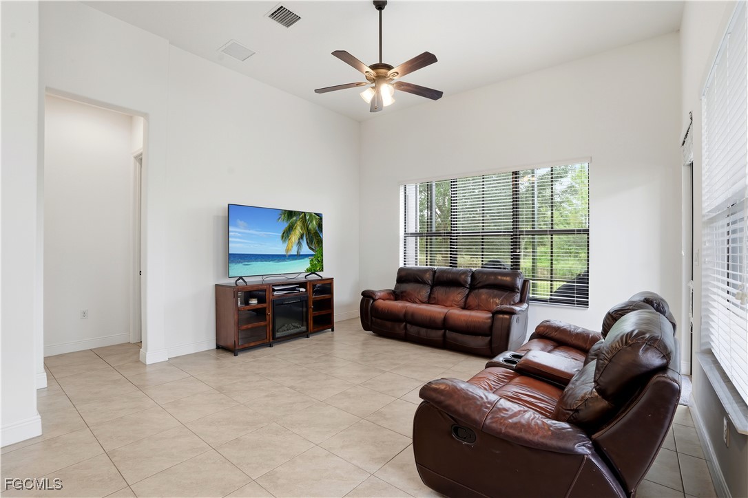 5355 Ferrari Avenue Ave Maria, FL 34142 - Photo 10 of 28 a living room with furniture and a flat screen tv