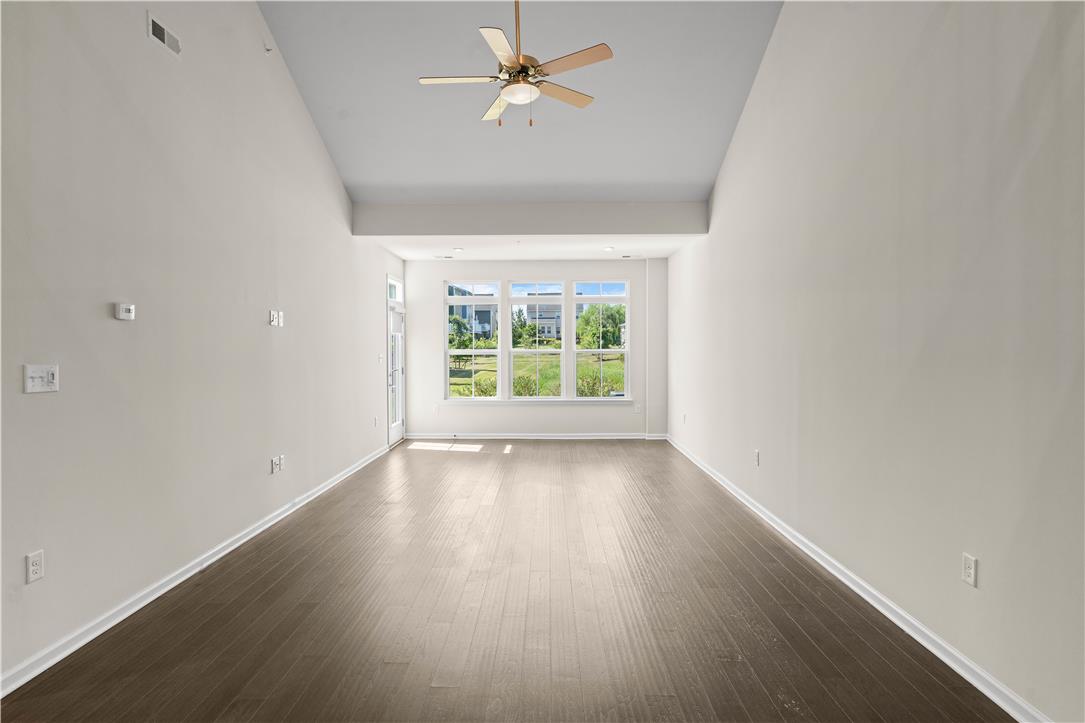 4758 Rafi Road Easton, PA 18045 - Photo 18 of 55 A spacious room offers rich hardwood flooring and a welcoming ceiling fan.