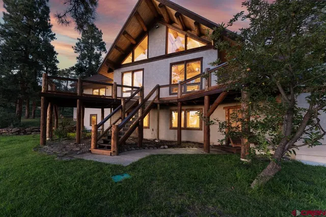 a view of a building with a yard