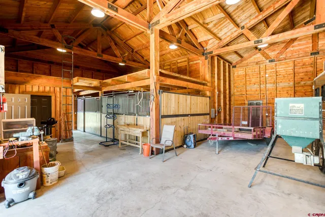 a view of gym with large windows